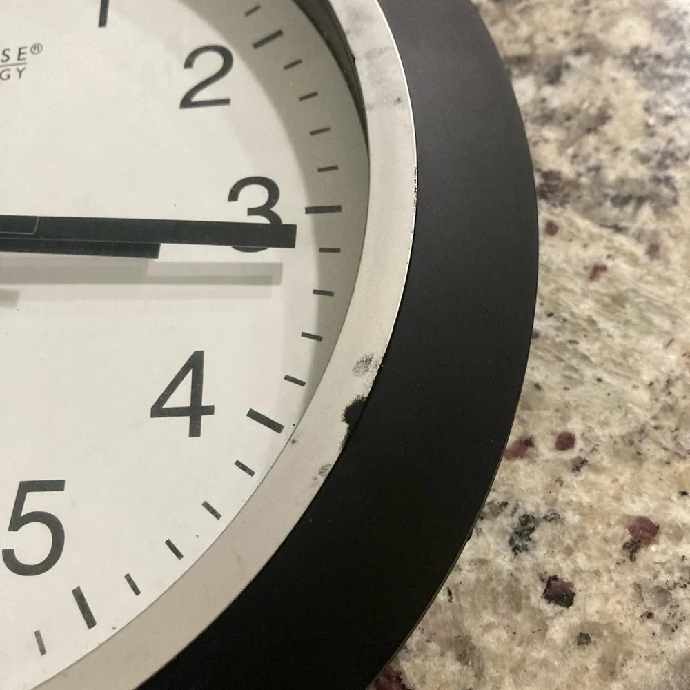 La Crosse Technology atomic analog wall clock has scuffs but works normally